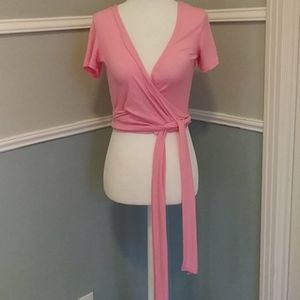 Pink wrap around top.